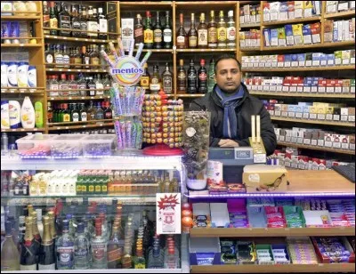 En Belgique, quel terme est entré dans le langage courant pour désigner une épicerie ouverte la nuit ?