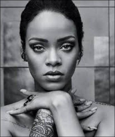Avec quel rappeur Rihanna partage-t-elle un featuring sur la chanson "Umbrella" ?