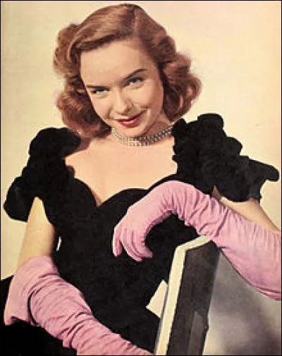 Comment s'appelle la femme qui garde Wilbur dans son compartiment dans le train ?