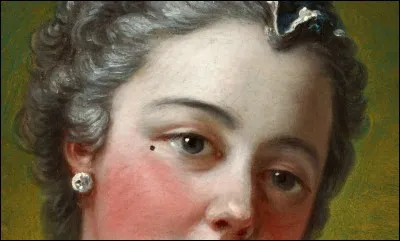 Comment nomme-t-on les faux grains de beauté que les femmes nobles posaient sur leur visage et qui dévoilaient leur caractère selon l'endroit où on les mettait ?