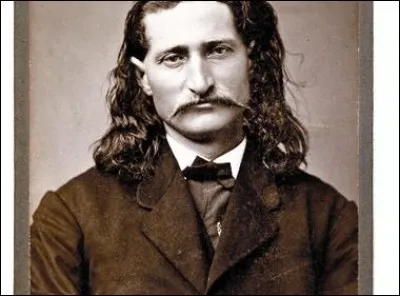 Reconnu comme exceptionnel au pistolet. Pendant la Guerre (1861-1865), il s'engage dans l'armée de l'Union. C'est là qu'il gagne son surnom à cause de ses exploits.
C'est un maître du maniement des revolvers. En 1867, il tue 3 hommes et en blesse un autre dans un saloon : comme shérif, il tua 3 soldats et une autre fois, il tua son assistant. 
En jouant au poker, il est salement tiré dans le dos.