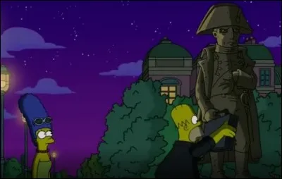 Homer récupère une manette sur la main d'une statue. Quel personnage est représenté par cette statue ?