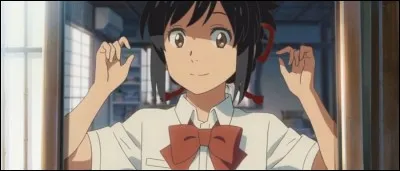 Comment Taki a-t-il l'habitude de coiffer Mitsuha quand il est dans son corps ?