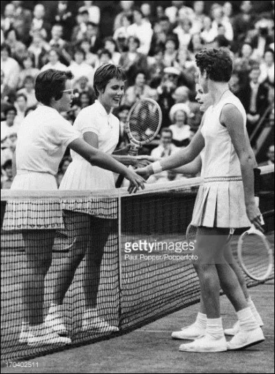 A quel &acirc;ge remporte-t-elle son premier titre de Grand Chelem en double ?