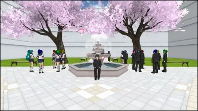 Combien y a-t-il de personnes à côté de la fontaine (en ne comptant pas Senpai, mais en comptant Musume) ?