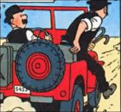 Pour quelle raison Dupont descend-il de la Jeep rouge en marche, dans "Tintin au Pays de l'Or Noir" ?