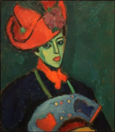 Encore du rouge pour relever le noir de la tenue dans ce portrait flamboyant. Qui est l'artiste ?