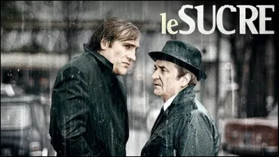 Quel acteur donne la r&eacute;plique &agrave; G&eacute;rard Depardieu et Michel Piccoli dans le film "Le Sucre", en 1978 ?