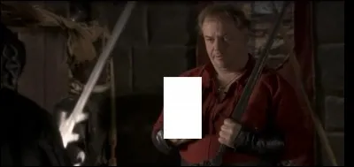 Dans cette scène qu'est-ce que Kadoc tient en main alors qu'il fait face au Répurgateur ?