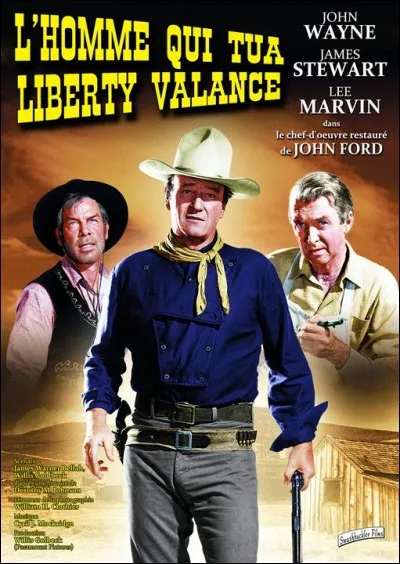 Dans "L'Homme qui tua Liberty Valance", quelles fleurs poussent dans le jardin de John Wayne ?