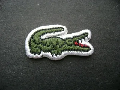Quel type d'animal dans son logo l'entreprise française de vêtements Lacoste arbore-t-elle ?