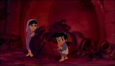 Dans "Aladdin" que donne Aladdin à manger à un enfant pauvre, malgré les protestations d'Abu ?