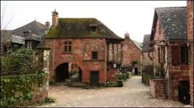 Quel est le nom de ce village de Corrèze contenant des maisons au grès rouge ?