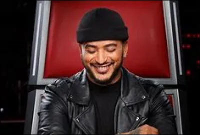 Il int&egrave;gre pour la premi&egrave;re fois sa place de coach dans quel "The Voice" ?