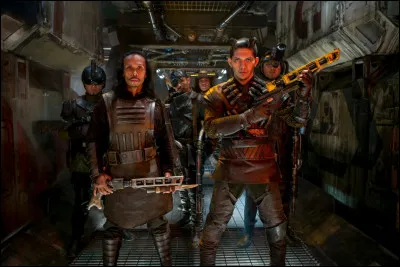 Comment s'appelle le gang qui fait son entrée sur le transporteur de Han en deuxième et qui indique à ce personnage qu'il leur a déjà fait deux fois faux-bond ?