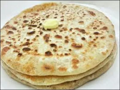 Quel est le plat indien farci de pommes de terre qui peut être fourré de légumes et servi avec du thé ?