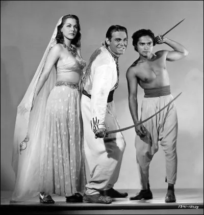 Dans quelle ville se déroule l'action du film "Les mille et une nuits", réalisé par John Rawlins ? 
Indice : capitale de l'Irak.