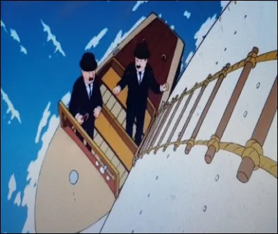 Mrs Dupont & Dupond montent à bord du bateau et arrêtent Tintin. De quoi est-il en possession ?
