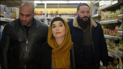 Dans quel film le personnage d'Hippolyte Girardot travail avec une dealeuse de drogue sans le savoir ?