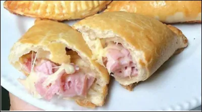 Quel est ce mets, un feuilleté en forme de chausson farci de viande, de pommes de terre et d'oeufs ?