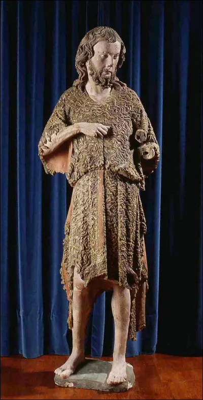 Cette sculpture de saint Jean le représente vêtu dune peau...