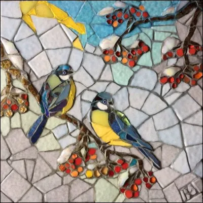 Dans une chanson de Goldman "Elle met du vieux pain sur son balcon", pour attirer quels oiseaux ?