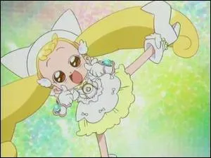 De quelle couleur est la tenue de Flora en apprentie sorcire ?