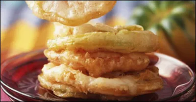 Quel est ce mets salé à base de tomates vertes et de pâte, le tout frit dans l'huile ?