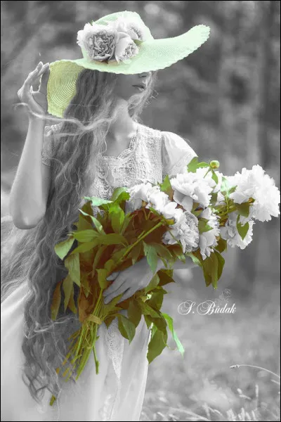 De qui sont les paroles "Enfin juillet les déshabille, mais elle, c'est une fille d'avril" ?