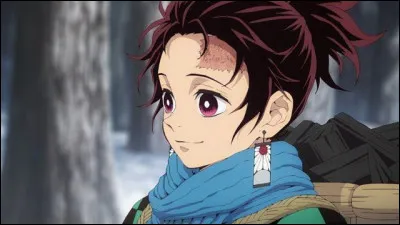 Quel est le nom du jeu de cartes que Tanjiro possède sur ses boucles d'oreilles ?