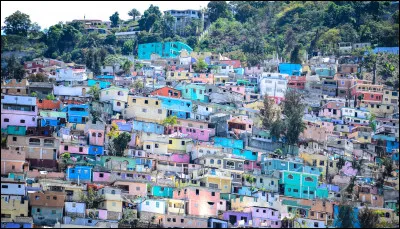 Dans la chanson de Jean-Pierre Ferland, "Je reviens chez nous", quel temps fait-il à Port-au-Prince ?