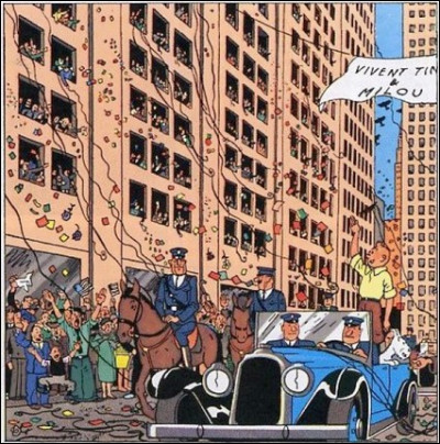 Dans cet album Tintin fait un triomphe pour avoir combattu des méchants. Quel est l'album ?