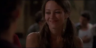 Dans quelle dimension Winnifred Burkle se retrouve-t-elle alors qu'elle range des livres dans la bibliothèque ?