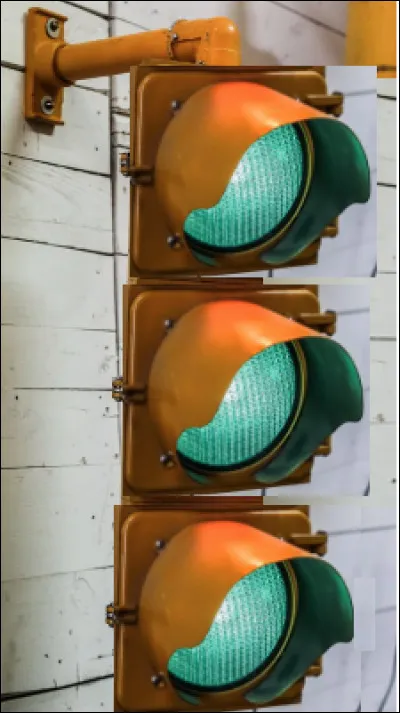 Le vert dans un feu tricolore de signalisation routière se trouve tout en haut.