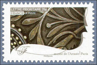 Sous vos yeux esbaudis se présente le détail de l'armure (v. 1620-1630) de Louis XIII. Le nom de l'art ici déployé est celui d'une rue tristement célèbre. Laquelle ?