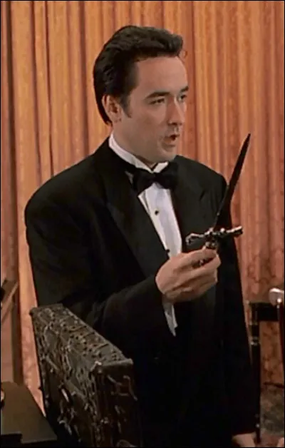 Dans quel film John Cusack est-il un journaliste ?