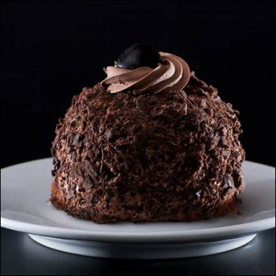 Quelle est cette pâtisserie belge, un gâteau meringué enroulé dans des copeaux de chocolat