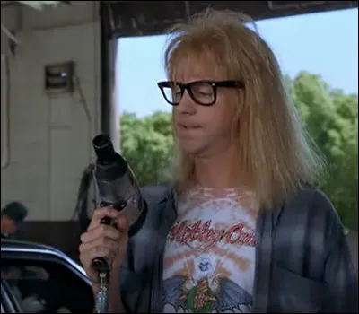 Quelle bêtise Garth fait-il chez le garagiste ?