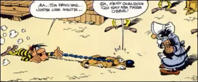 Dans quelle série BD voit-on ce prisonnier aplati sur le sol avec un chien ?