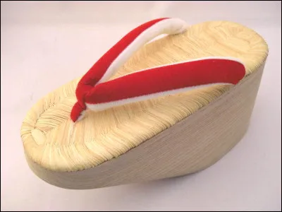 Quelle est cette très haute chaussure traditionnelle japonaise fabriquée dans une seule pièce de bois ?