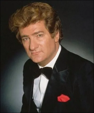 Lui n'est qu'un numéro dans un building de 20 étages.
On doit la chanson à Eddy Mitchell.
Quel est le titre ?