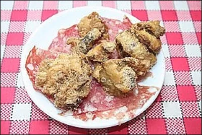 Cuisine : comment se nomme cette spécialité lyonnaise constituée de porc cuit dans sa graisse et servie en amuse gueule ?