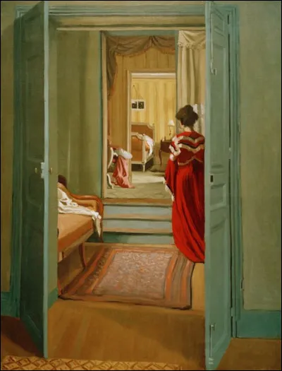 Au premier plan une porte est entrouverte. Le tableau s'intitule "L'Intérieur avec femme en rouge". Qui en est l'auteur ?