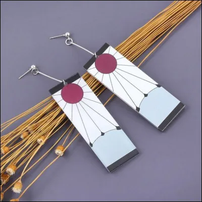 À qui appartenaient les boucles d'oreilles de Tanjiro avant lui ?