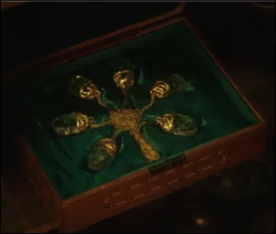 Quel objet Zelena utilise-t-elle pour se transformer en Marianne, la femme de Robin des Bois ?