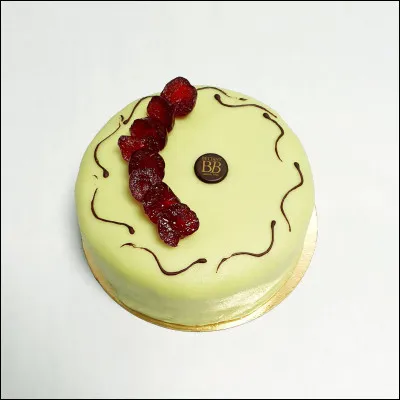 Gastronomie : Quelle pâtisserie est constituée d'une génoise imbibée de kirsch fourrée d'une crème pâtissière aux fruits confits et recouverte de pâte d'amande, le plus souvent verte ?