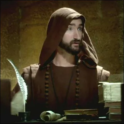 Comment appelle-t-on une décoration exécutée à la main qui orne un manuscrit et qui peut être carolingienne ou ottonienne ?