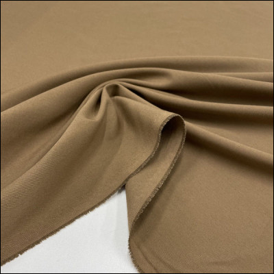 À partir de quelle matière naturelle est fabriqué le tissu "gabardine" ?