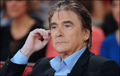 Avec quel autre chanteur a-t-il coécrit la chanson ''Plus quailleurs'' pour Céline Dion ?