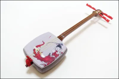 De quel instrument Zenitsu joue-t-il dans la maison Kyogoku ? (Dans le quartier des plaisirs pour ceux qui ont pas compris)